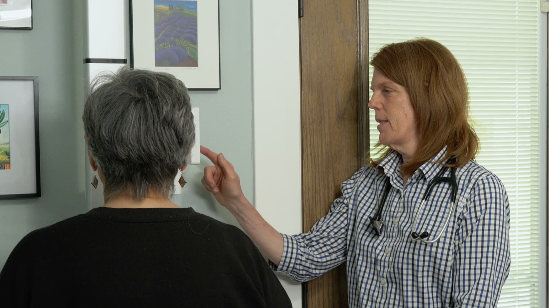 Dr. Gilbert checking patient stats.